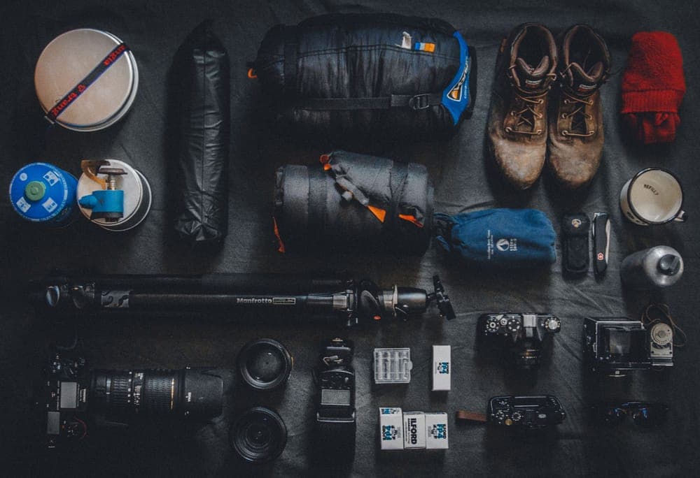 Outdoor gear laid out neatly on a flat surface